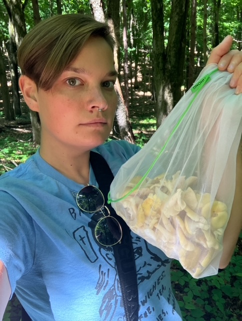  Larisa with a bag full of golden oyster mushrooms (Pleurotus citrinopileatus). Ann Arbor, Michigan.
